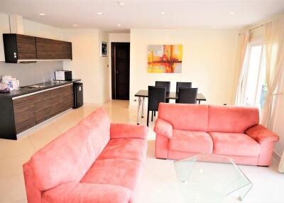 Spacious living room with an open kitchen and dining area