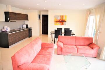 Spacious living room with an open kitchen and dining area