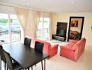 Spacious living room with dining area and large windows