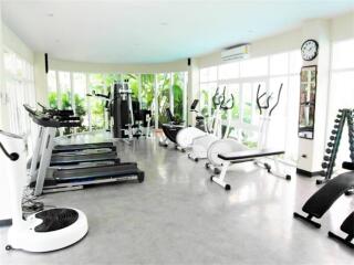 Spacious fitness center with various workout equipment