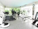 Spacious fitness center with various workout equipment