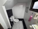 Small bathroom with sloped ceiling