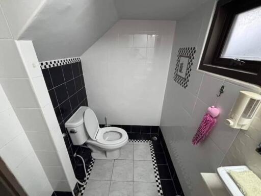 Small bathroom with sloped ceiling