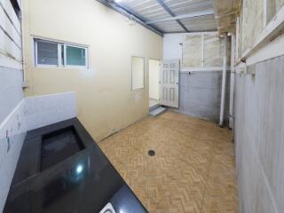 Basic kitchen with tiled flooring and neutral colors