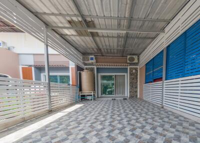 Covered garage with tiled flooring