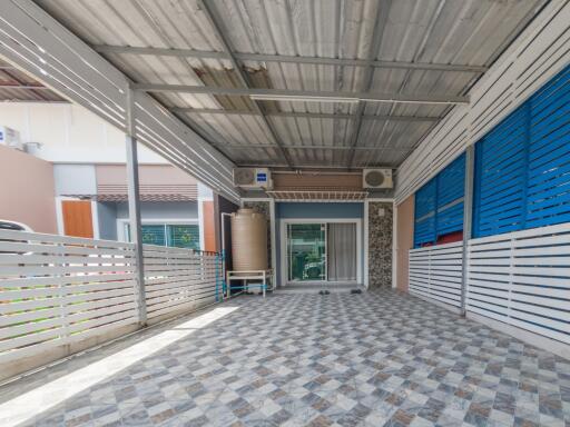 Covered garage with tiled flooring