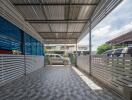 Covered carport with tiled flooring