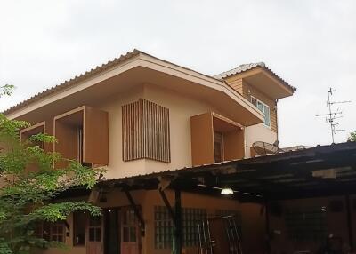 Two-story house with garage and balcony