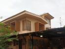 Two-story house with garage and balcony