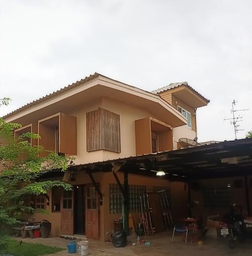 Two-story house with garage and balcony