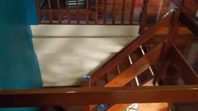 Wooden staircase with railing