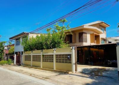 Two-story house with a fenced yard