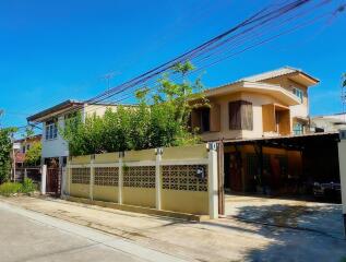 Two-story house with a fenced yard