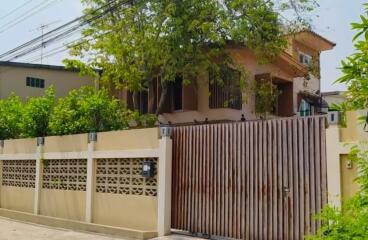 Front view of a house with a gated entrance