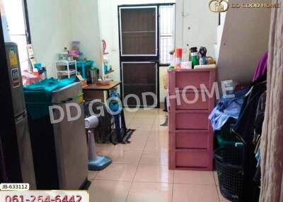 A kitchen with appliances and storage