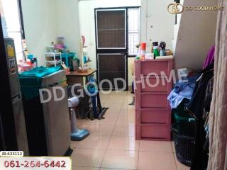 A kitchen with appliances and storage