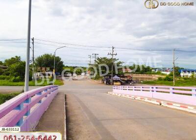 View of a road with a bridge in a residential area