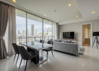 Modern living room with large windows and city view