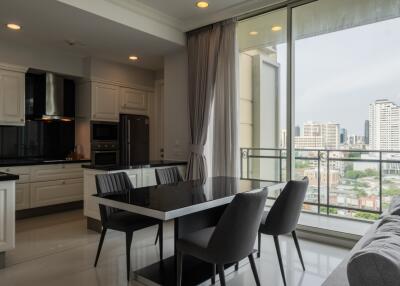 Modern kitchen and dining area with city view