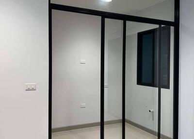 Empty room with large glass sliding doors