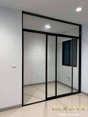 Empty room with large glass sliding doors