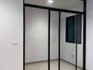 Empty room with large glass sliding doors