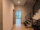 Modern hallway with staircase leading to upper floor