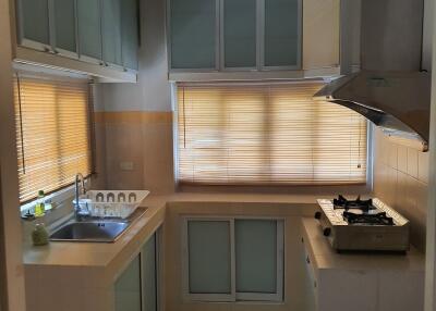 Modern kitchen with ample storage and large window