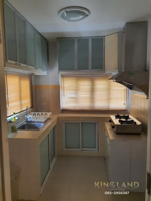 Modern kitchen with ample storage and large window