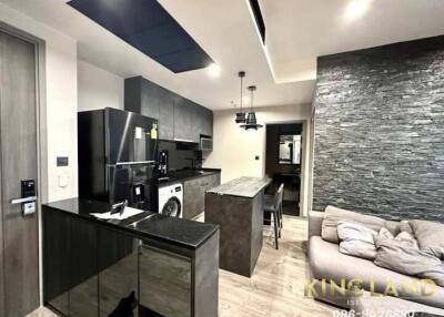 Modern kitchen with island adjacent to living room