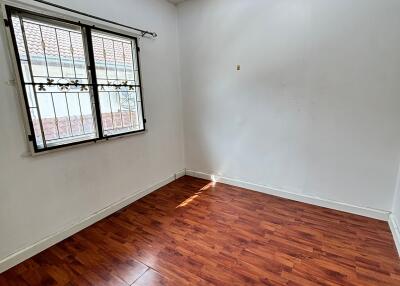 Empty room with hardwood floor and window