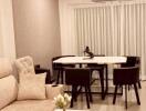 Modern living and dining area with comfortable seating and elegant decor