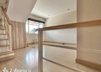 Bright living area with modern staircase