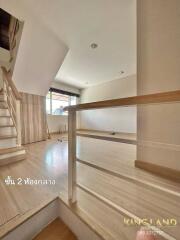 Bright living area with modern staircase