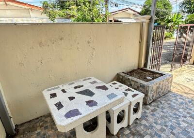 Outdoor patio with stone table and benches