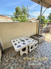 Outdoor patio with stone table and benches