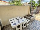 Outdoor patio with stone table and benches