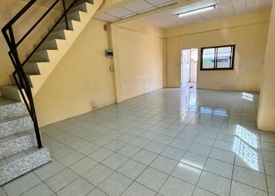 Spacious living area with tiled flooring