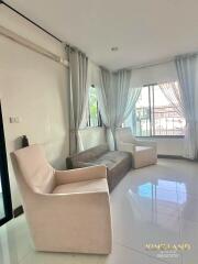 Well-lit living room with modern furniture