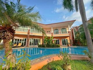 Outdoor view of a luxury house with a swimming pool