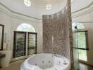 Bathroom with jacuzzi and glass shower