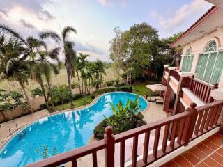 View from balcony overlooking swimming pool and garden