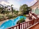 View from balcony overlooking swimming pool and garden