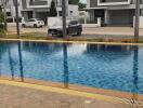 View of swimming pool and houses