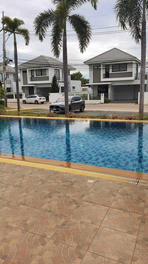 View of swimming pool and houses