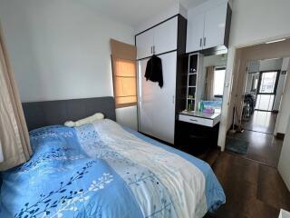 Modern bedroom with large wardrobe and natural light