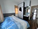 Modern bedroom with large wardrobe and natural light