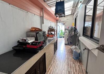 Long narrow kitchen with countertop and appliances