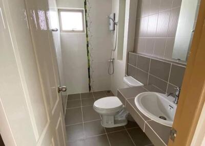 Modern bathroom with tiled floor and shower