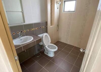 Bathroom with sink, toilet, and shower